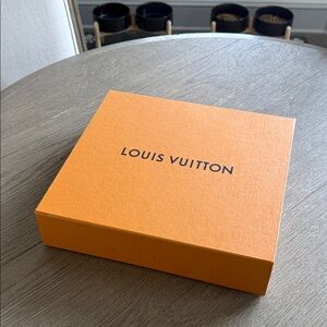 Louis Vuitton orange sweater box.